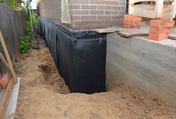 Happy homeowners after waterproofing job in Piney Point